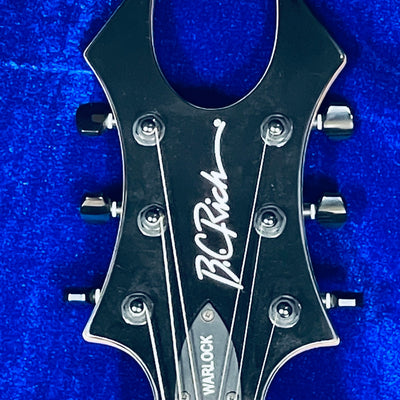 Used B.C.RICH SE WARLOCK ACRYLIC body w/Softcase